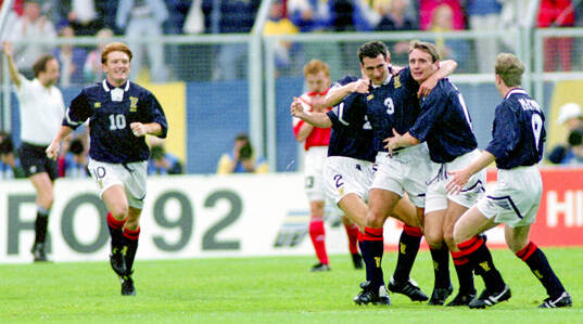 Scotlands Paul McStay (3) celebrates his 1-0 goal with team