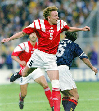 Oleg Kuznetsov of CIS against Scotlands Ally McCoist