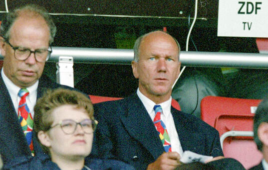 Sweden manager Tommy Svensson (R) watches the game