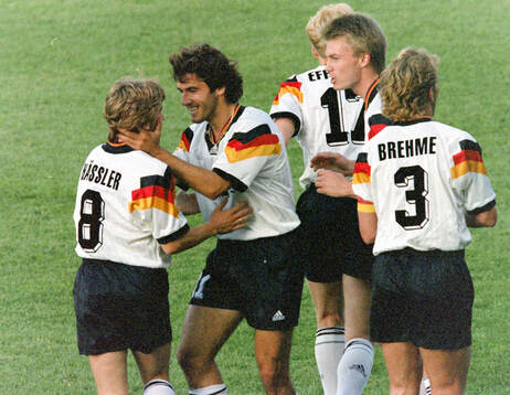 Thomas Hassler of Germany (L) celebrates his goal for 1-0