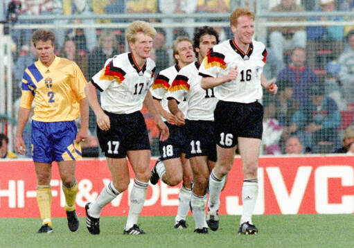 Karl-Heinz Riedle (11) of Germany celebrates