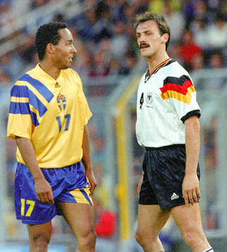 Martin Dahlin of Sweden and Jurgen Kohler of Germany