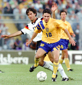 Anders Limpar of Sweden against Karl-Heinz Riedle of Germany