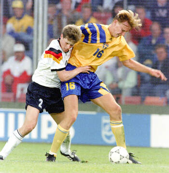 Kennet Andersson of Sweden against Stefan Reuter of Germany