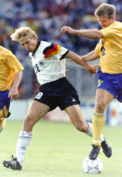 Jurgen Klinsmann of Germany against Roland Nilsson of Sweden