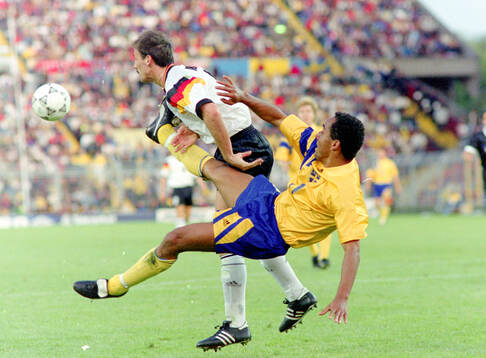 Martin Dahlin of Sweden against Jurgen Kohler of Germany
