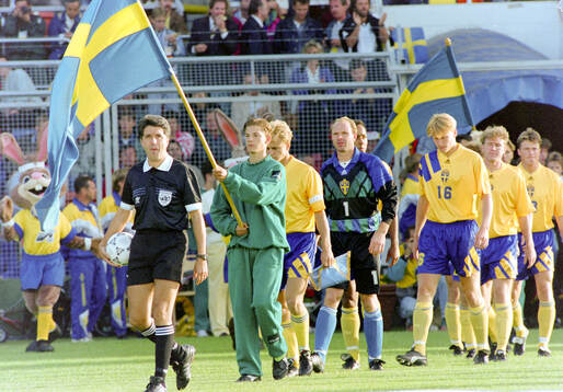 The Swedish team enters the pitch led by (L-R) Jonas Thern,