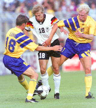 Swedens Roger Ljung (L) and Klas Ingesson against Germanys