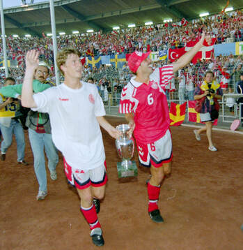 Denmarks Brian Laudrup and Kim Christofte celebrates with