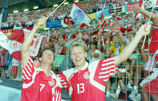 Denmarks John Jensen and Henrik Larsen celebrates