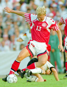 Denmarks Henrik Larsen tussles with Germanys Thomas Hassler