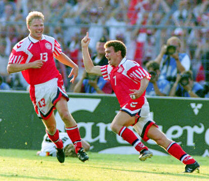 Denmarks John Jensen (R) celebrates with Henrik Larsen