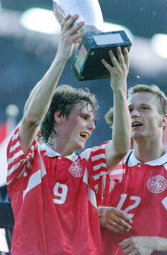 Denmarks Flemming Povlsen celebrates with the trophy