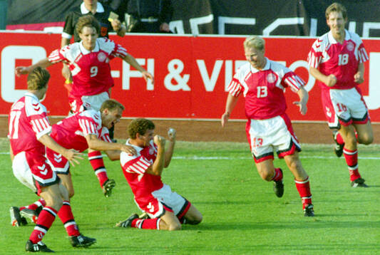 Denmarks John Jensen (C) celebrates