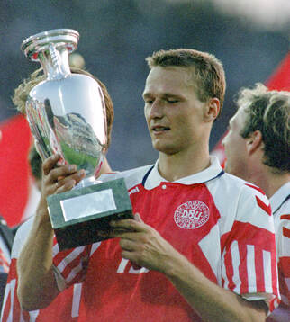 Denmarks Torben Piechnik celebrates with the trophy