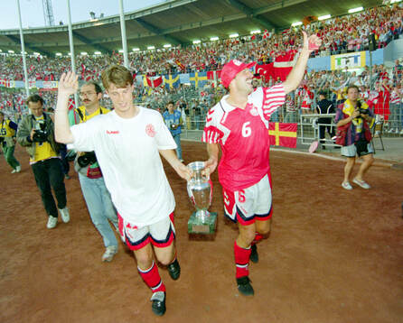 Denmarks Brian Laudrup and Kim Christofte celebrates with