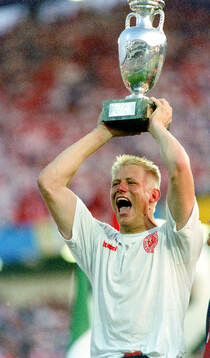Denmarks Peter Schmeichel celebrates with the trophy