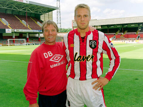 Jonas Wirmola of Sheffield United (R) with manager Dave