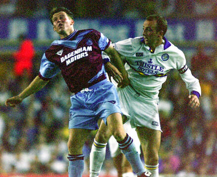 Martin Allen of West Ham (L) against Gary McAllister of