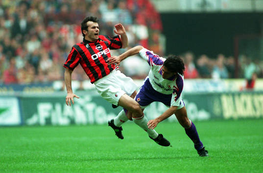 Dejan Savicevic åker på en rejäl tackling från en