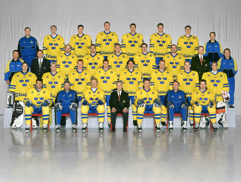 Players and team staff of Sweden pose for a team photo