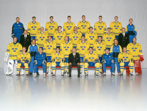 Players and team staff of Sweden pose for a team photo