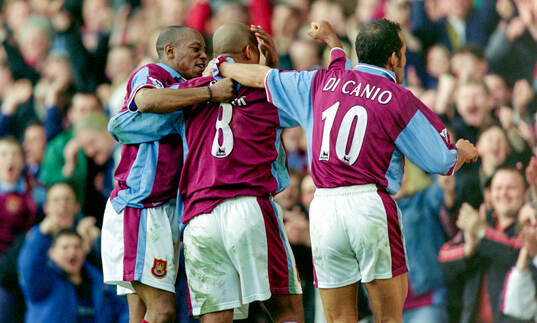 Trevor Sinclair (C) of West Ham celebrates his goal with