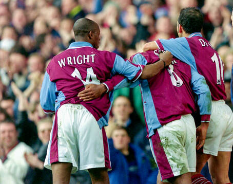 Trevor Sinclair (C) of West Ham celebrates his goal with