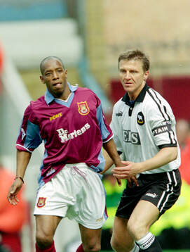 Ian Wright of West Ham against Jacob Laursen of Derby