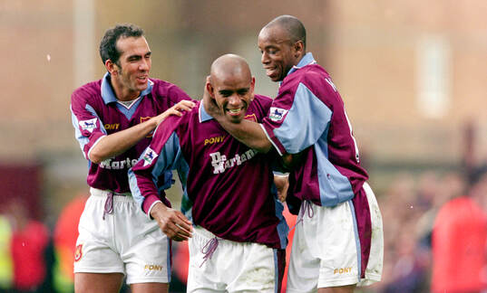 Trevor Sinclair (C) of West Ham celebrates his goal with
