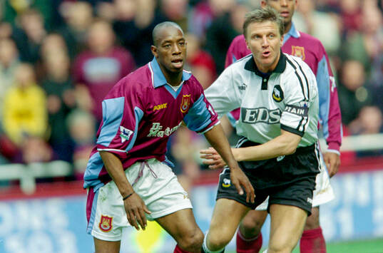 Ian Wright of West Ham against Jacob Laursen of Derby